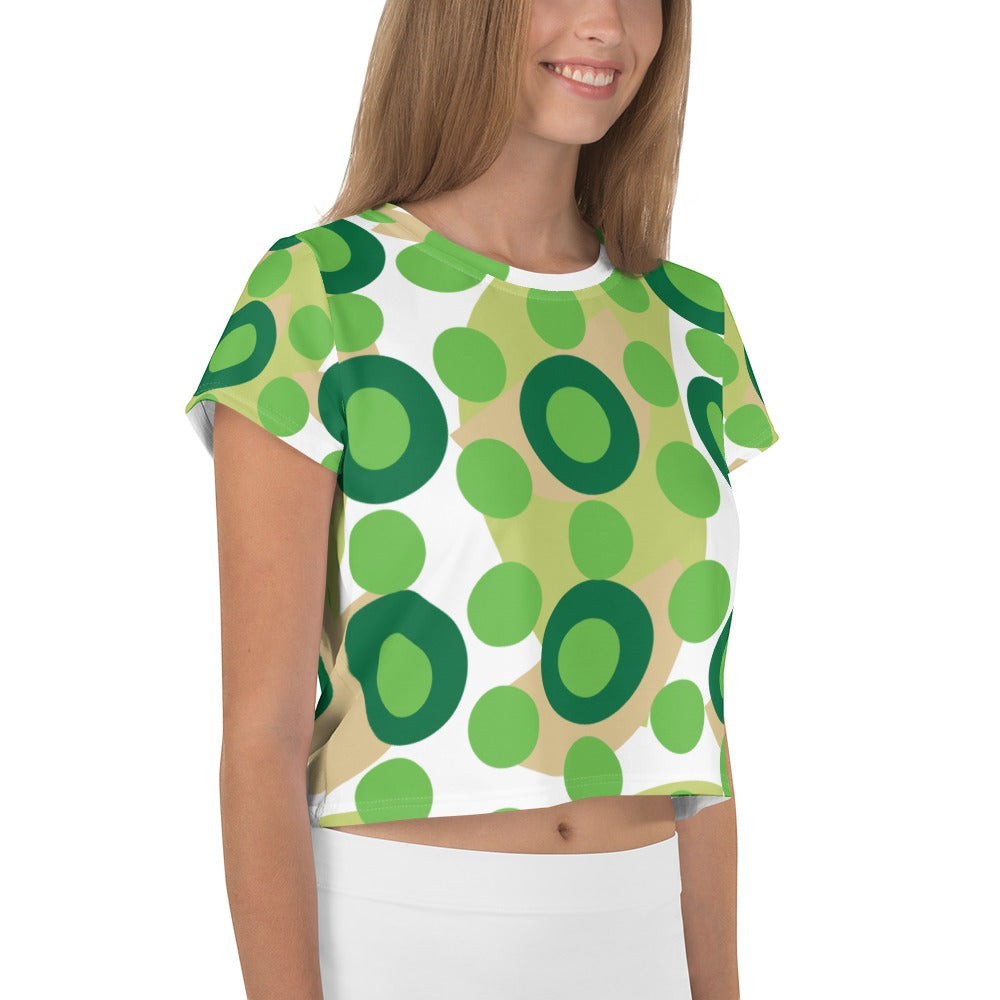 Good Wishes 365 retro mod kelly green polka dot crop tee worn by a smiling woman in a studio setting.