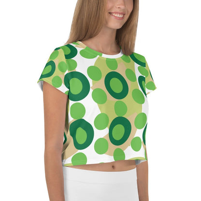 Good Wishes 365 retro mod kelly green polka dot crop tee worn by a smiling woman in a studio setting.