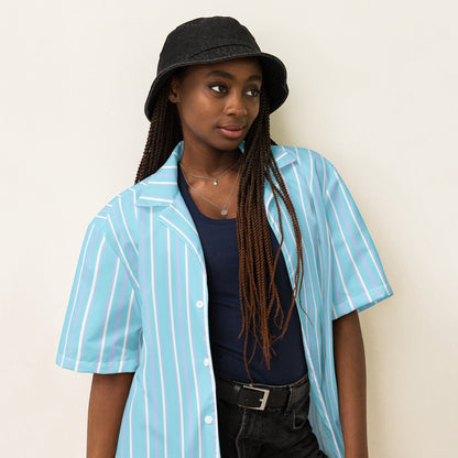 Good Wishes 365 light blue striped short sleeve button-up shirt with UPF50+ protection worn over a navy tank top.