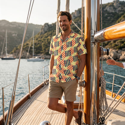 Good Wishes 365 men's short sleeve button-down shirt with a geometric pattern, worn on a sailboat.All-over print, unisex button shirt.