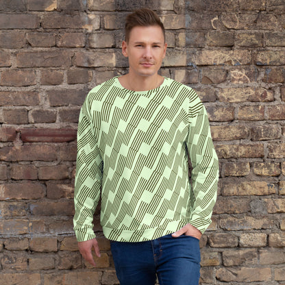 Good Wishes 365 unisex sweatshirt in mint green with dark geometric rhythm print worn by a man against a brick wall