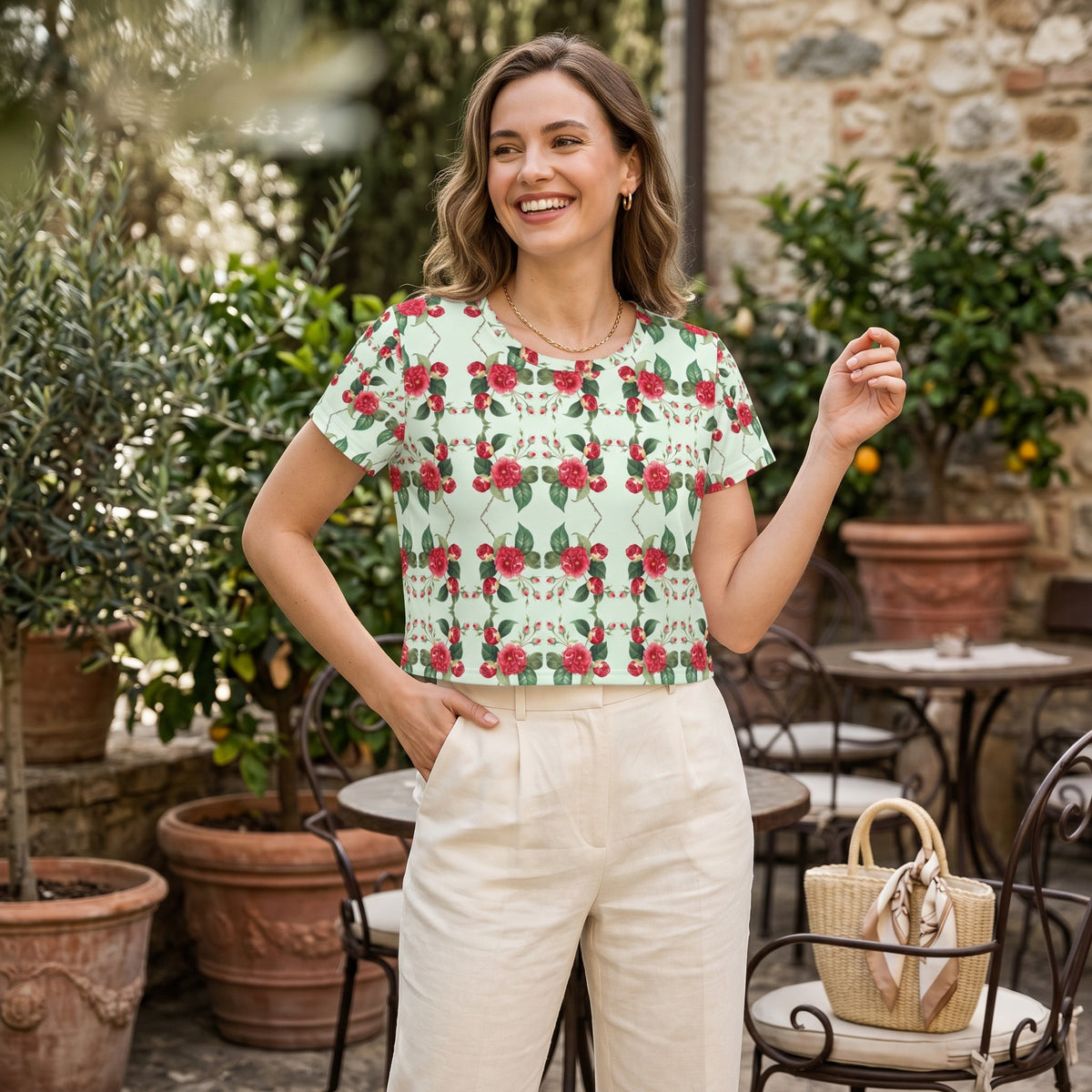 Good Wishes 365 women's mint green crop tee with red rose pattern, made from stretchy jersey fabric in a garden setting.