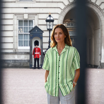 Good Wishes 365 pastel mint green vertical stripe button-down shirt with UPF50+ protection worn by a woman outdoors.