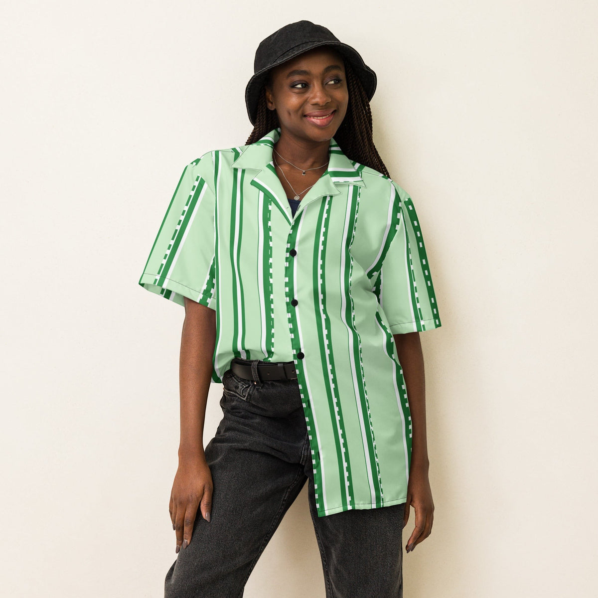 Good Wishes 365 retro pastel mint striped UPF50+ button-down shirt worn by a model with a black bucket hat.