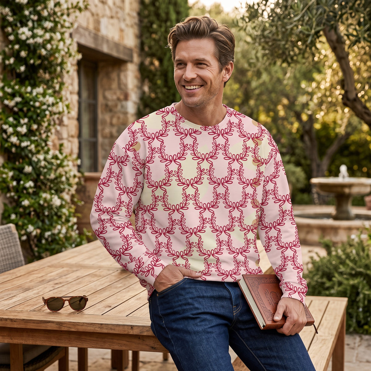 Good Wishes 365 unisex recycled sweatshirt with red laurel leaf crown print on misty rose, worn by a smiling man.