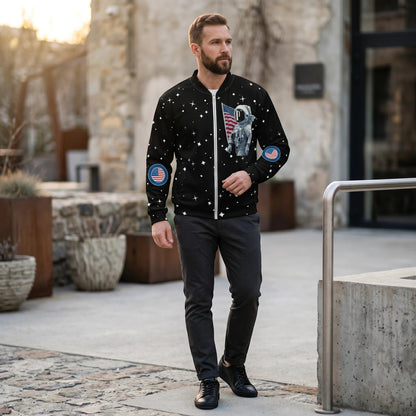Good Wishes 365 unisex bomber jacket featuring a black moon landing astronaut print with stars and American flag patches.