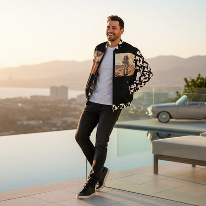Good Wishes 365 unisex bomber jacket with moon landing print worn by a smiling man on a sunny terrace.