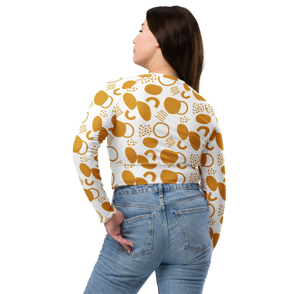 Good Wishes 365 mustard yellow abstract geometric print long-sleeve crop top worn by a woman, back view