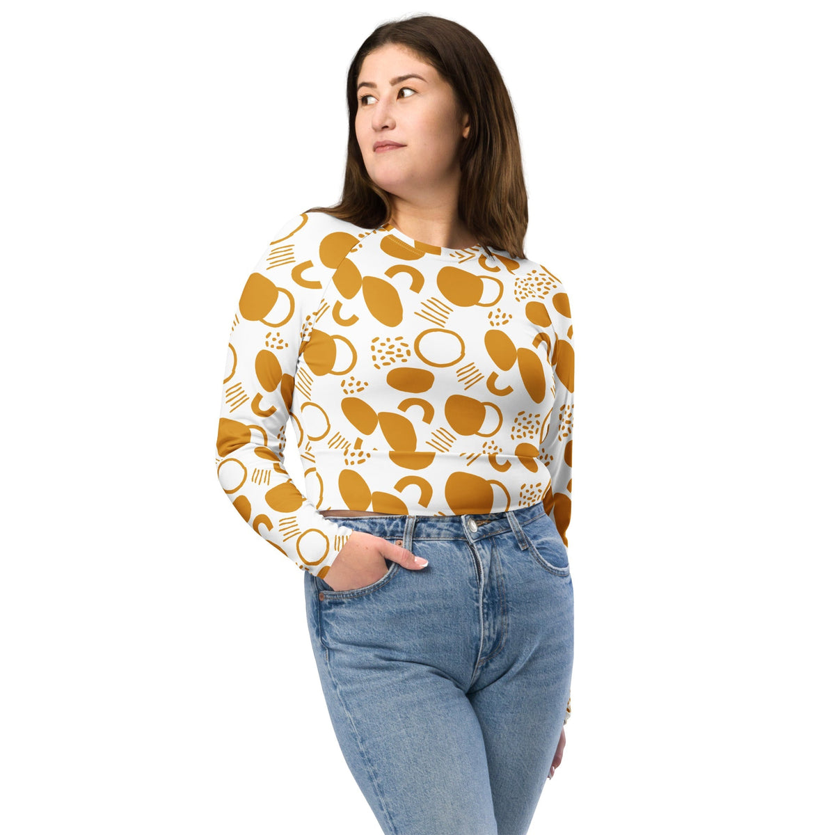 Good Wishes 365 long-sleeve crop top in mustard yellow abstract geometric print worn by a woman with blue jeans