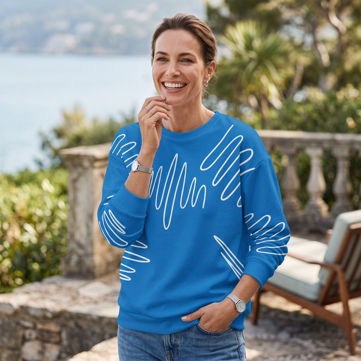 Good Wishes 365 navy blue recycled sweatshirt with white abstract scribble lines worn by a smiling woman outdoors.