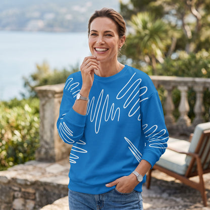 Good Wishes 365 navy blue recycled sweatshirt with white abstract scribble lines worn by a smiling woman outdoors.