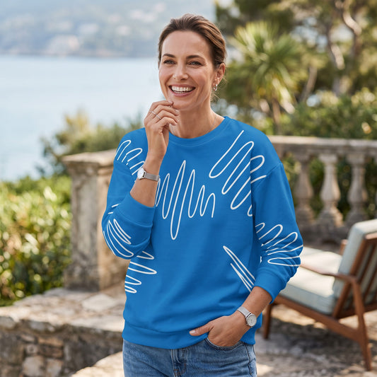 Good Wishes 365 navy blue recycled sweatshirt with white abstract scribble lines worn by a smiling woman outdoors.