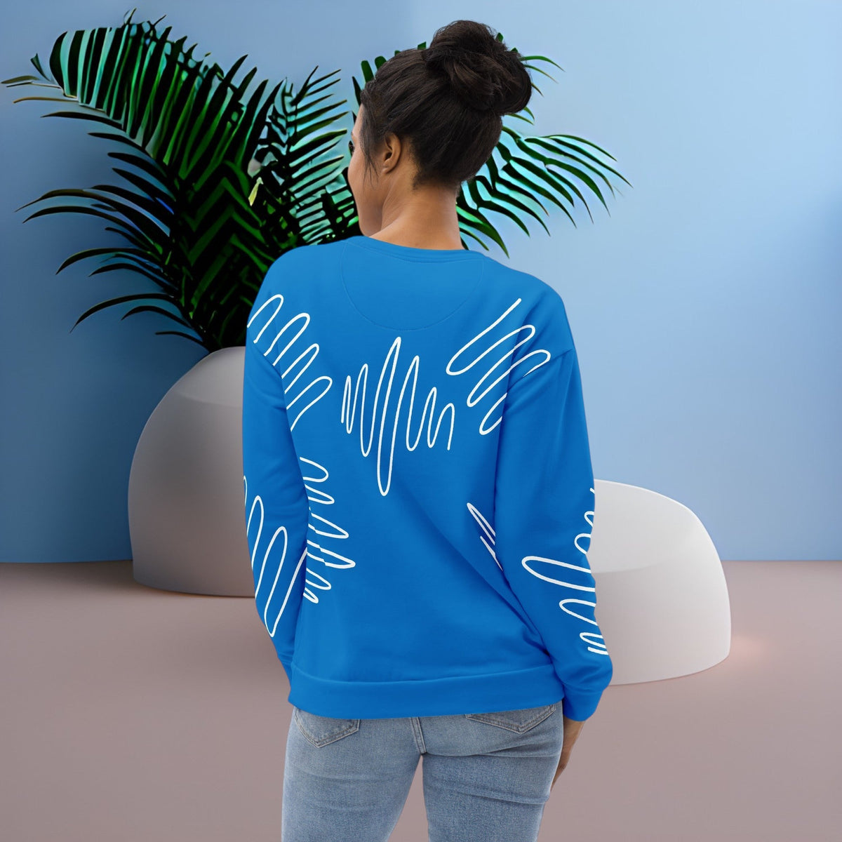 Good Wishes 365 navy blue recycled sweatshirt with white abstract scribble lines worn by a woman, back view
