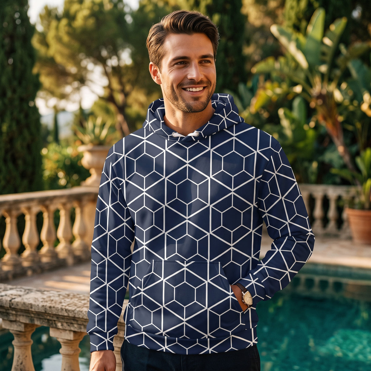 Good Wishes 365 navy recycled hoodie with white geometric hexagon print worn by a man by a pool