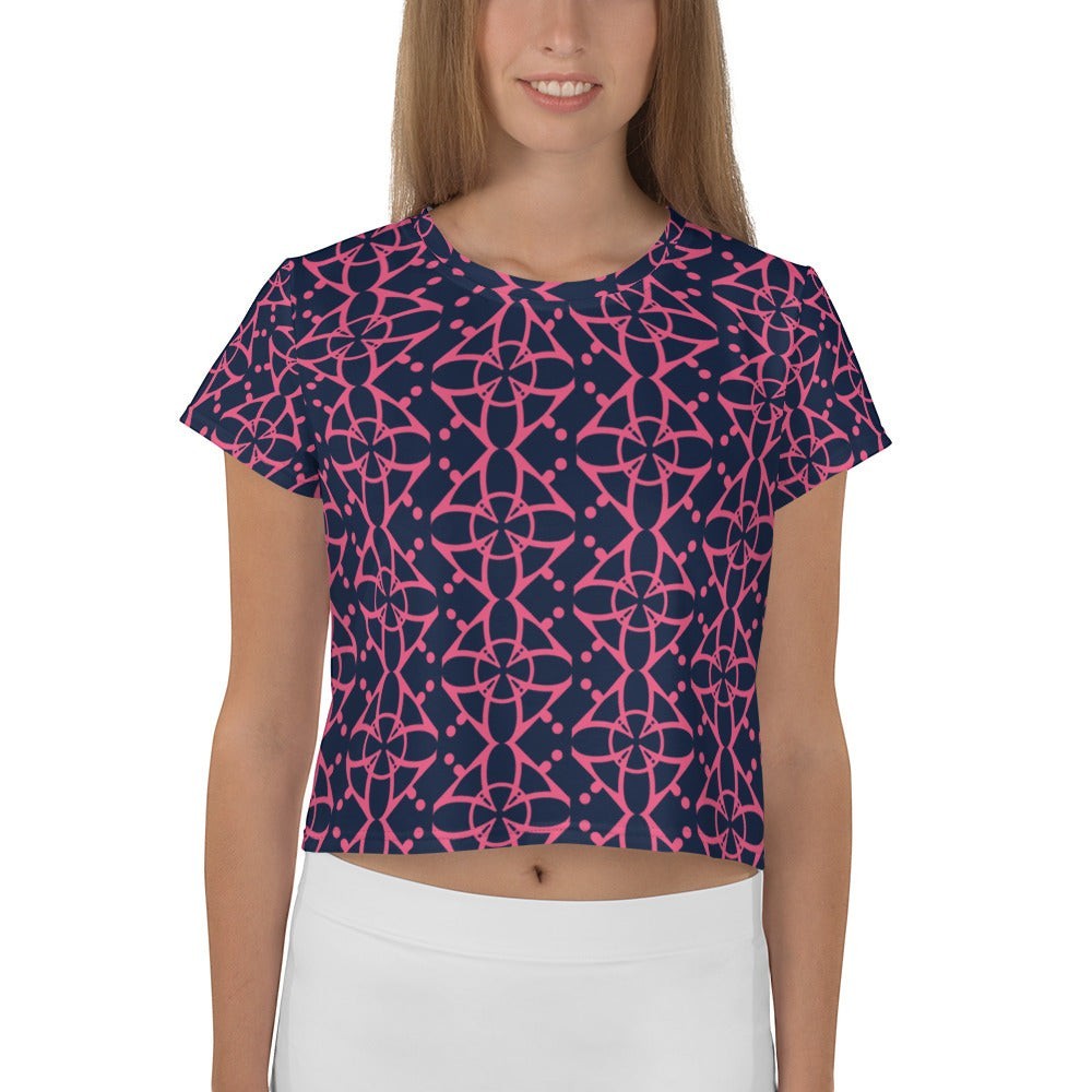 Good Wishes 365 navy blue crop tee with a vibrant pink interconnected geometric pattern worn by a model.