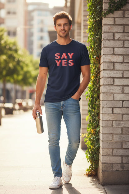 Good Wishes 365 navy blue cotton unisex Say Yes graphic t-shirt worn by a man with light blue jeans and white sneakers