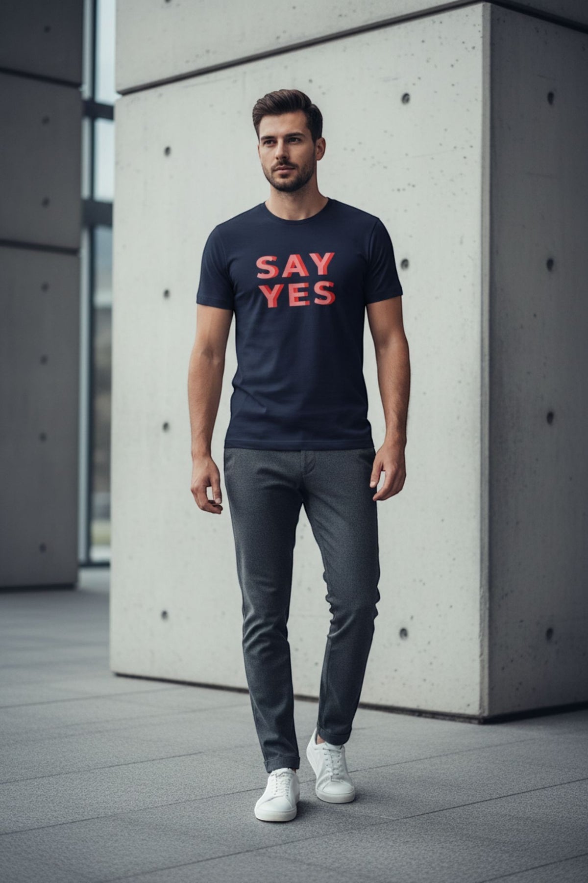 Good Wishes 365 navy blue cotton unisex t-shirt with red Say Yes graphic text worn by a man in a modern setting