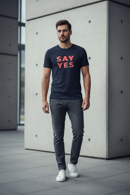 Good Wishes 365 navy blue cotton unisex t-shirt with red Say Yes graphic text worn by a man in a modern setting