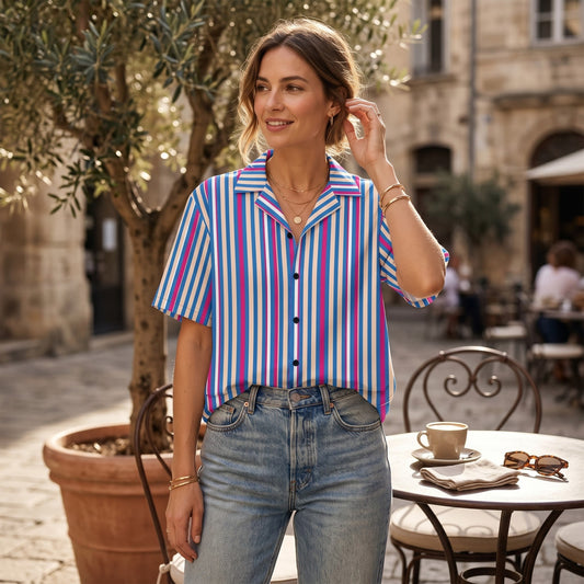 Good Wishes 365 unisex navy blue striped short sleeve button shirt with a camp collar worn by a woman at a cafe.