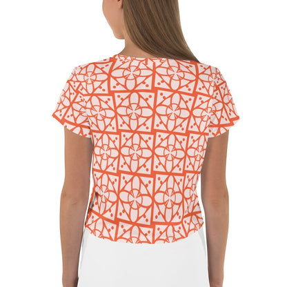 Good Wishes 365 orange and white geometric all-over print crop tee worn by a woman, back view.