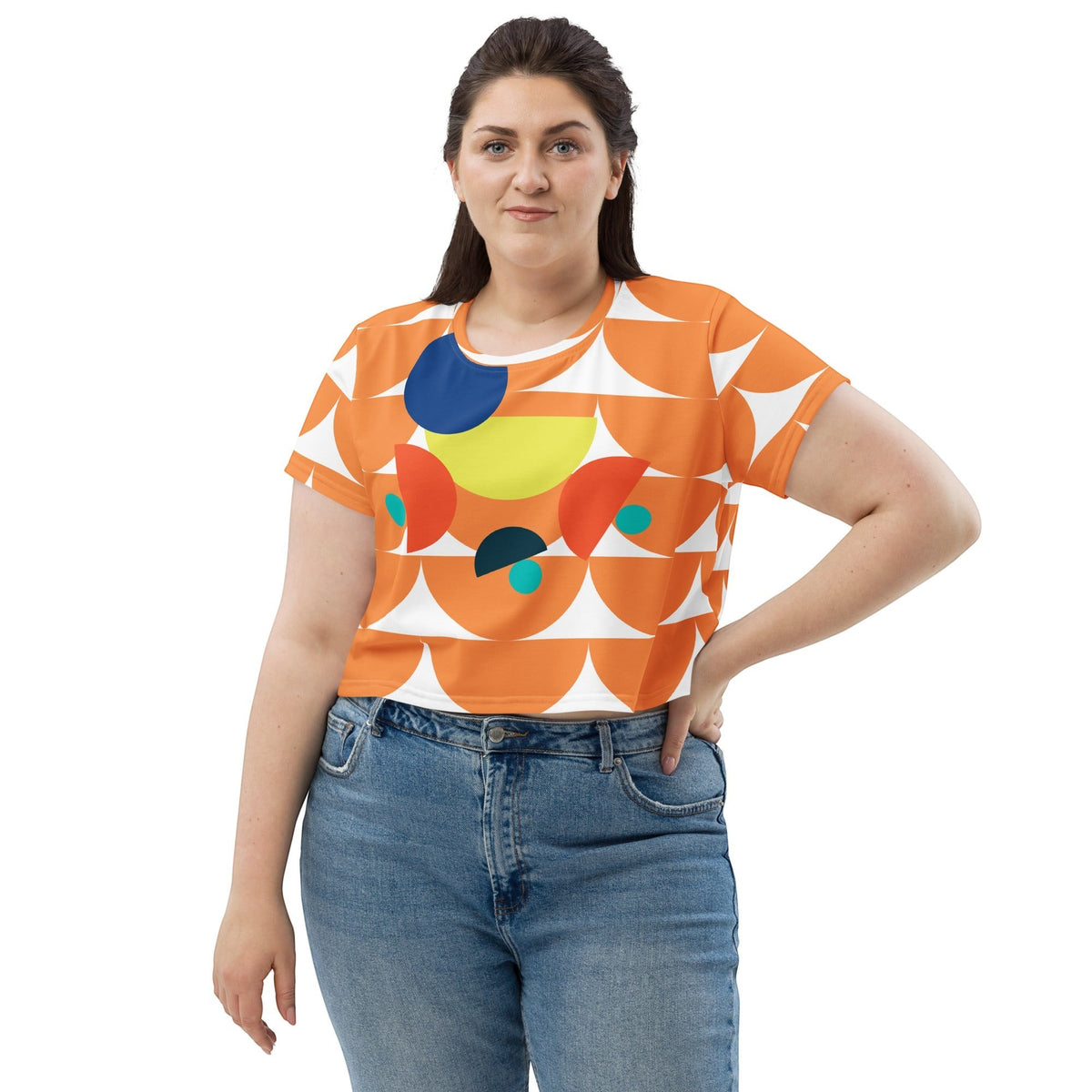 Good Wishes 365 orange crop tee with geometric mushroom pattern, crew neck, and short sleeves worn by a woman.