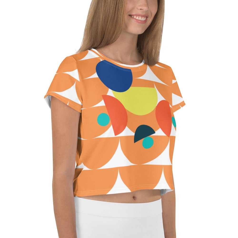 Good Wishes 365 orange crop tee with geometric mushroom graphic print worn by a smiling woman