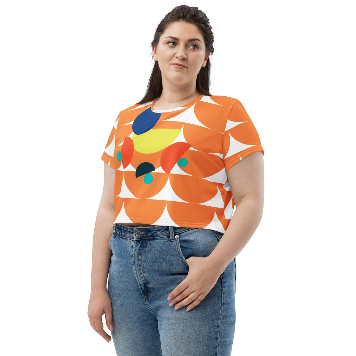 Good Wishes 365 orange crop tee with geometric mushroom graphic print worn by a woman with blue jeans
