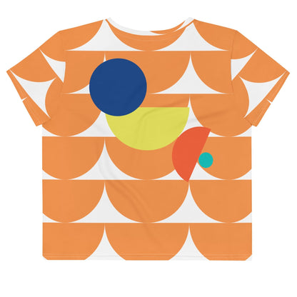 Good Wishes 365 orange crop tee featuring a geometric mushroom-inspired abstract print in blue, yellow, and orange.