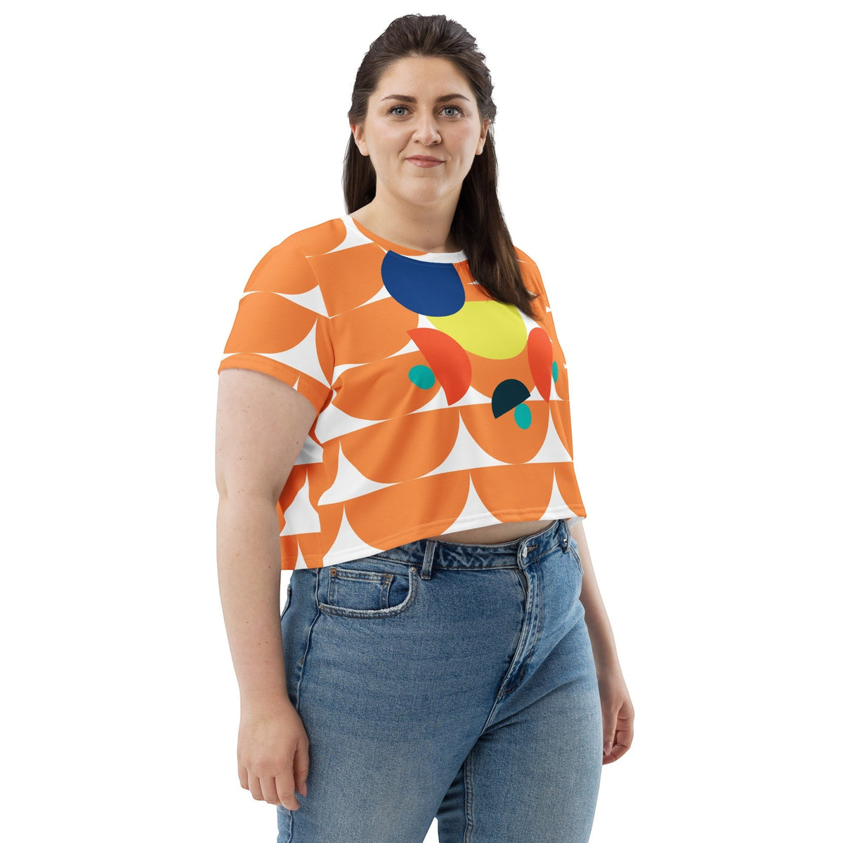 Good Wishes 365 orange crop tee featuring a geometric mushroom graphic print with blue and yellow accents on a model.