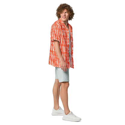 Good Wishes 365 unisex button shirt in orange with white abstract print, worn by a curly-haired man with light shorts.