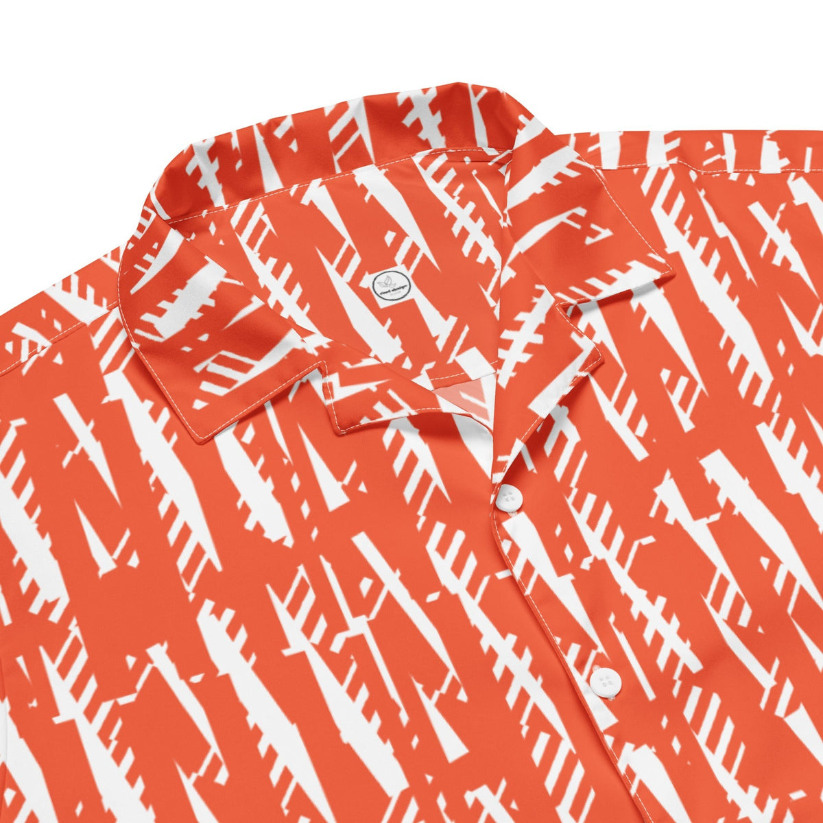 Good Wishes 365 unisex button shirt in bright orange with a white abstract geometric pattern and classic collar.