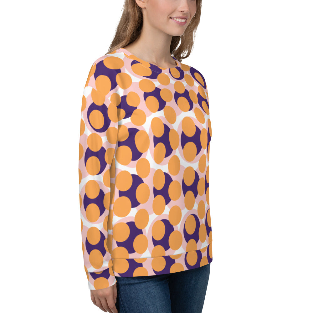 Good Wishes 365 women's recycled sweatshirt featuring a 70s pop art circle pattern in orange, purple, and soft pink.