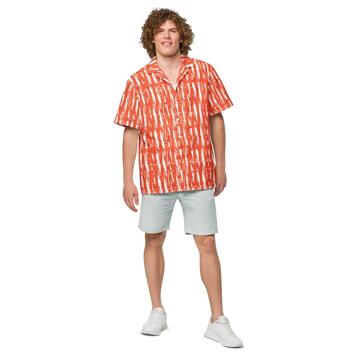 Good Wishes 365 unisex button shirt in orange with white abstract print, worn by a man with light grey shorts.