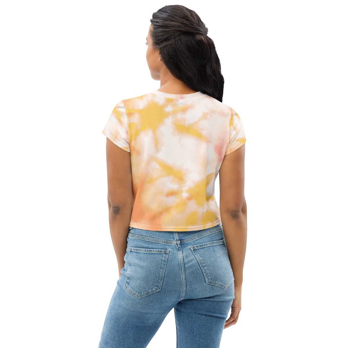 Good Wishes 365 crew neck crop top with orange and yellow tie-dye print worn by a woman with blue jeans, back view