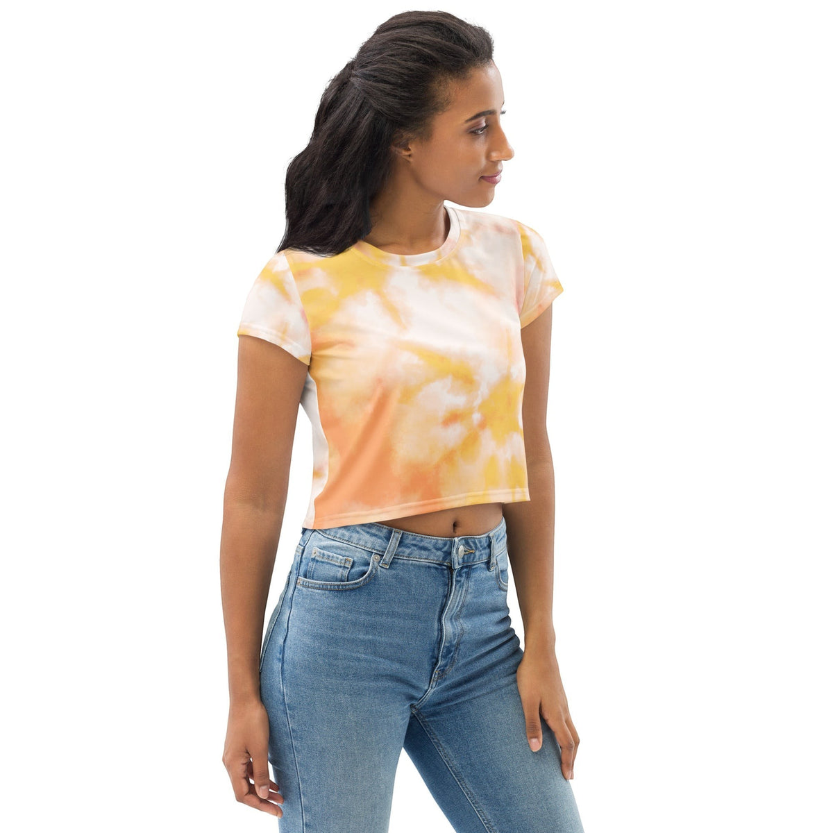 Good Wishes 365 crew neck crop top in orange and yellow tie-dye print worn by a woman with blue denim jeans
