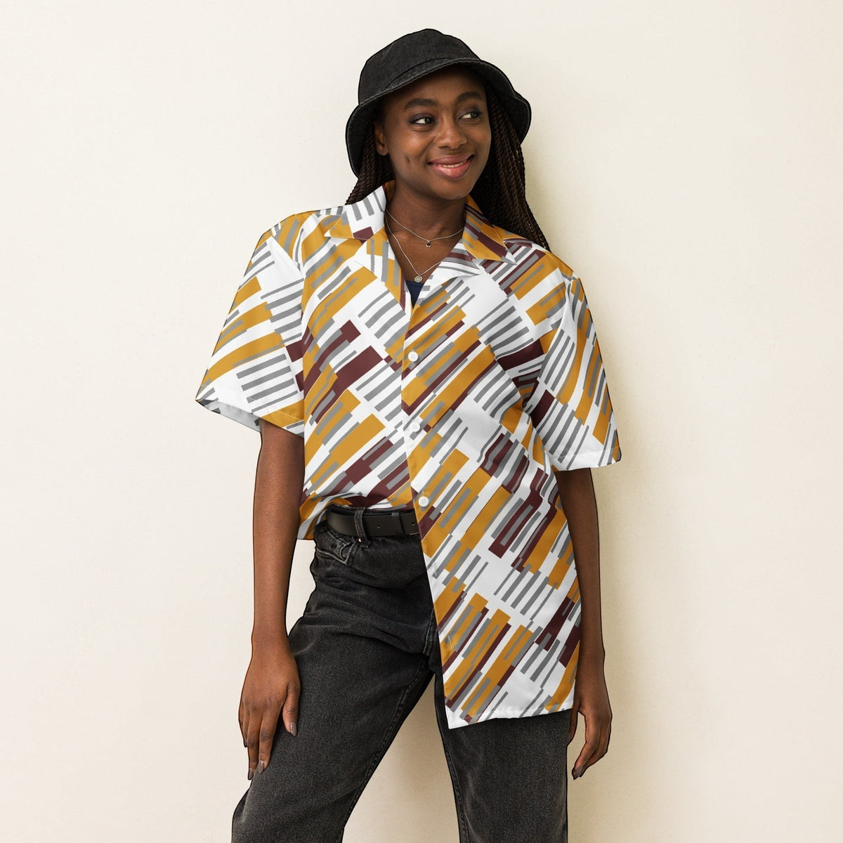 Good Wishes 365 unisex oversized button shirt with a geometric pattern in mustard, grey, and white, worn by a model.