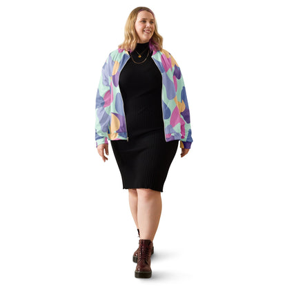 Good Wishes 365 unisex bomber jacket with pastel abstract print worn by a woman over a black ribbed midi dress