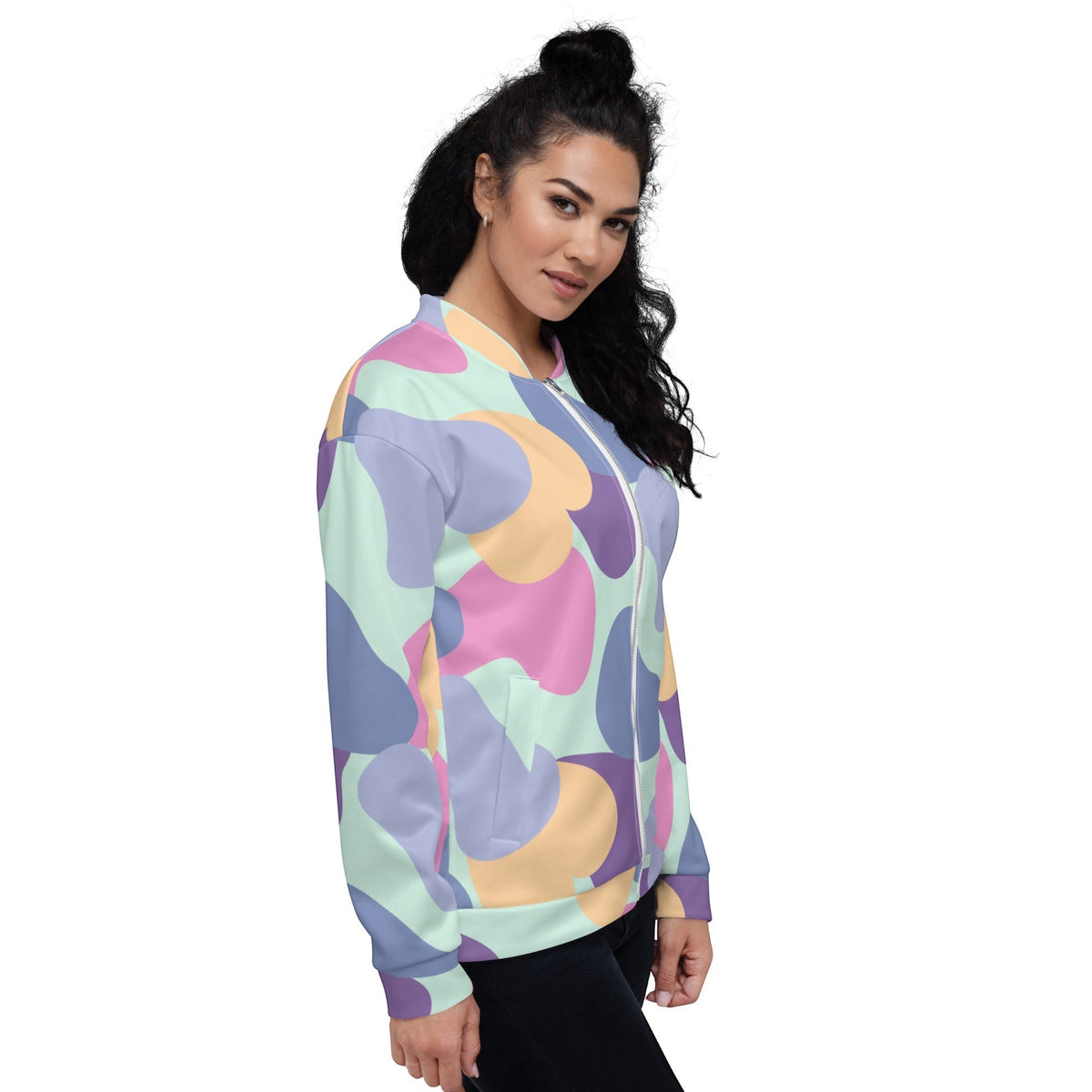 Good Wishes 365 unisex bomber jacket with a pastel abstract print in mint, lavender, peach, and violet on a model.