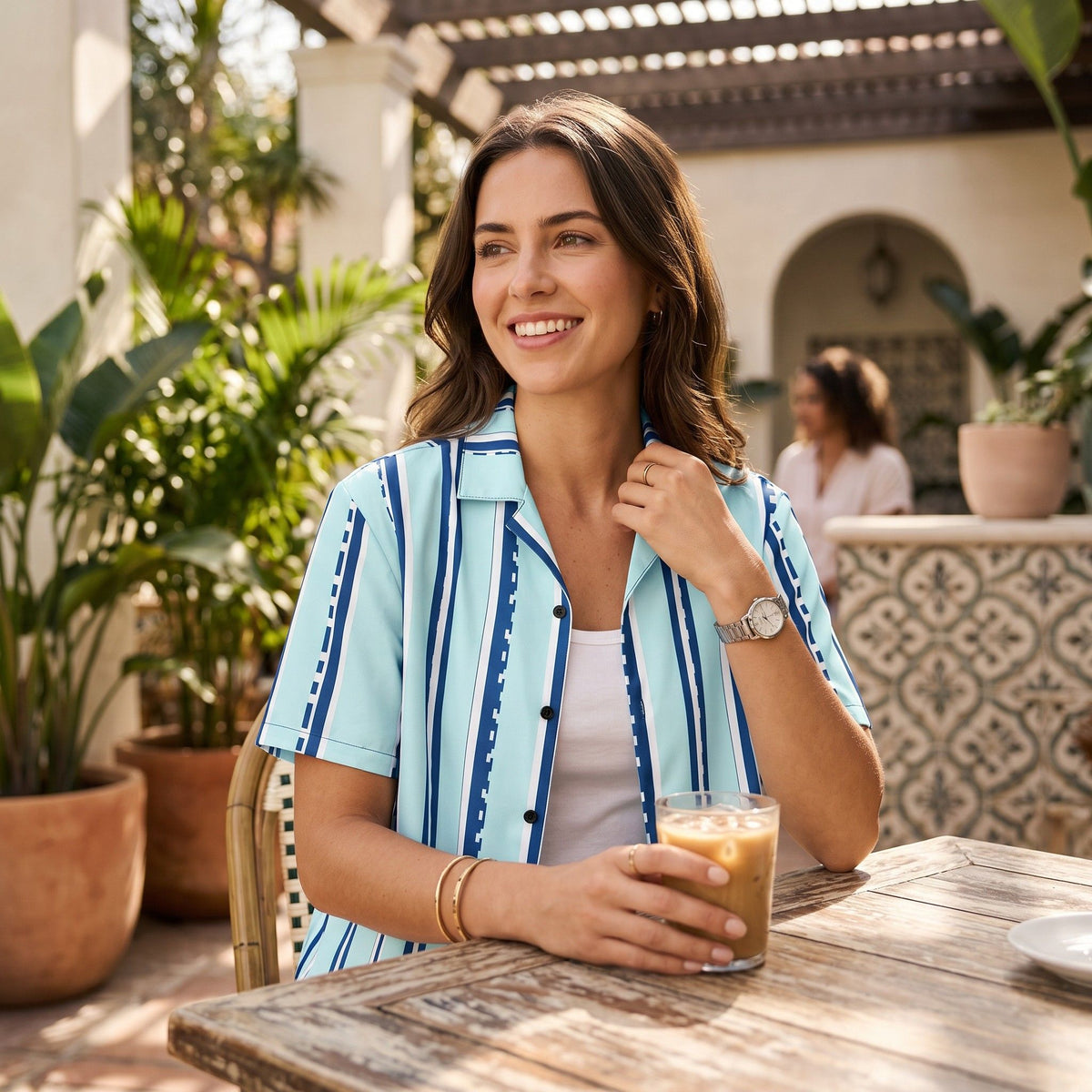 Good Wishes 365 retro pastel cyan button-down shirt with navy and white vertical stripes worn by a smiling woman.