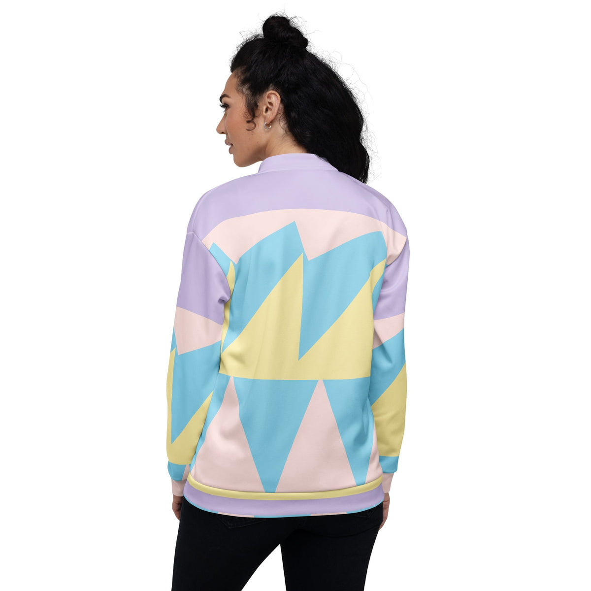 Good Wishes 365 unisex bomber jacket featuring a pastel geometric pattern in blue, yellow, and pink on a model's back.