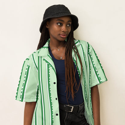 Good Wishes 365 unisex pastel mint striped button-down shirt with UPF50+ protection worn by a model in a bucket hat.