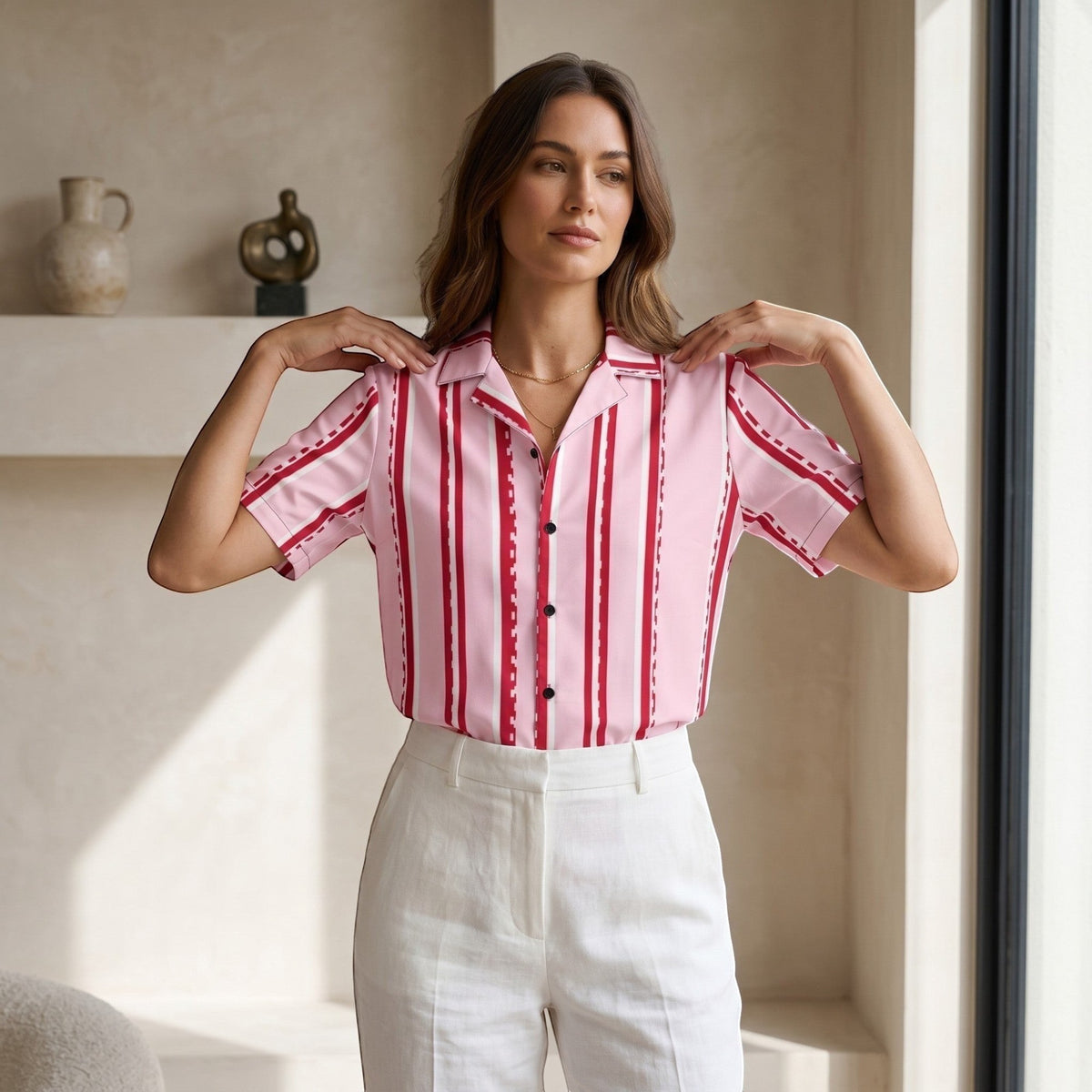 Good Wishes 365 pastel pink short sleeve button shirt with red and white pixelated stripes worn by a woman.