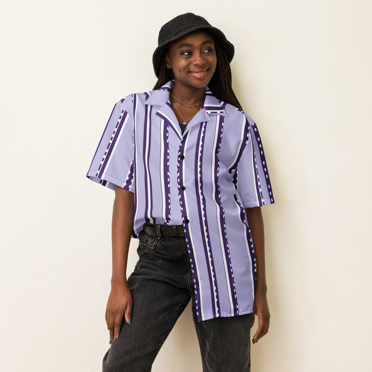 Good Wishes 365 model wearing a retro pastel violet and white striped short sleeve button-down shirt with a bucket hat.