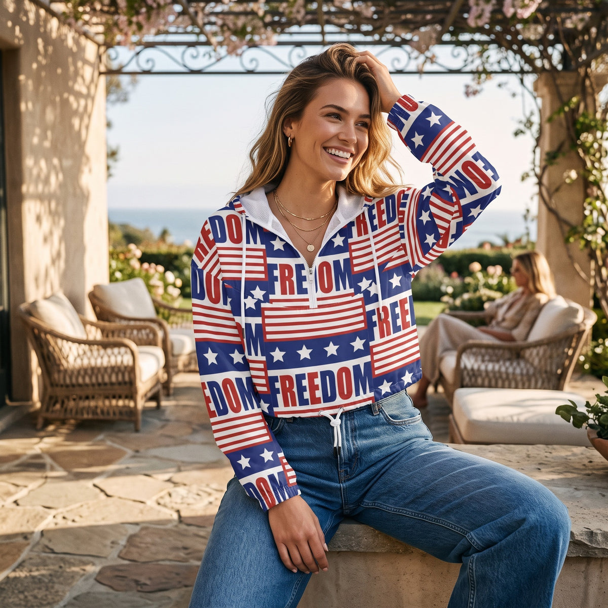 Good Wishes 365 women's cropped windbreaker with USA flag and FREEDOM print, featuring a half-zip and drawstring hem.