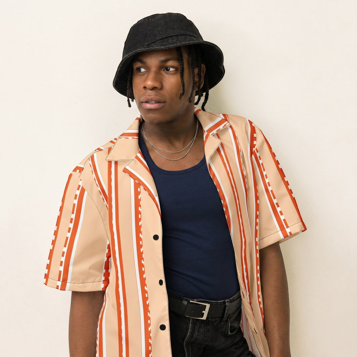 Good Wishes 365 retro pastel peach striped short sleeve button shirt worn by a model in a black bucket hat.