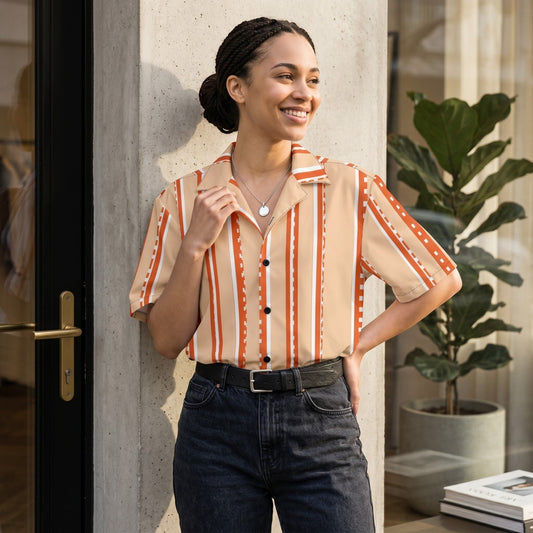 Good Wishes 365 retro pastel peach striped short sleeve button shirt worn by a smiling woman with braided hair.