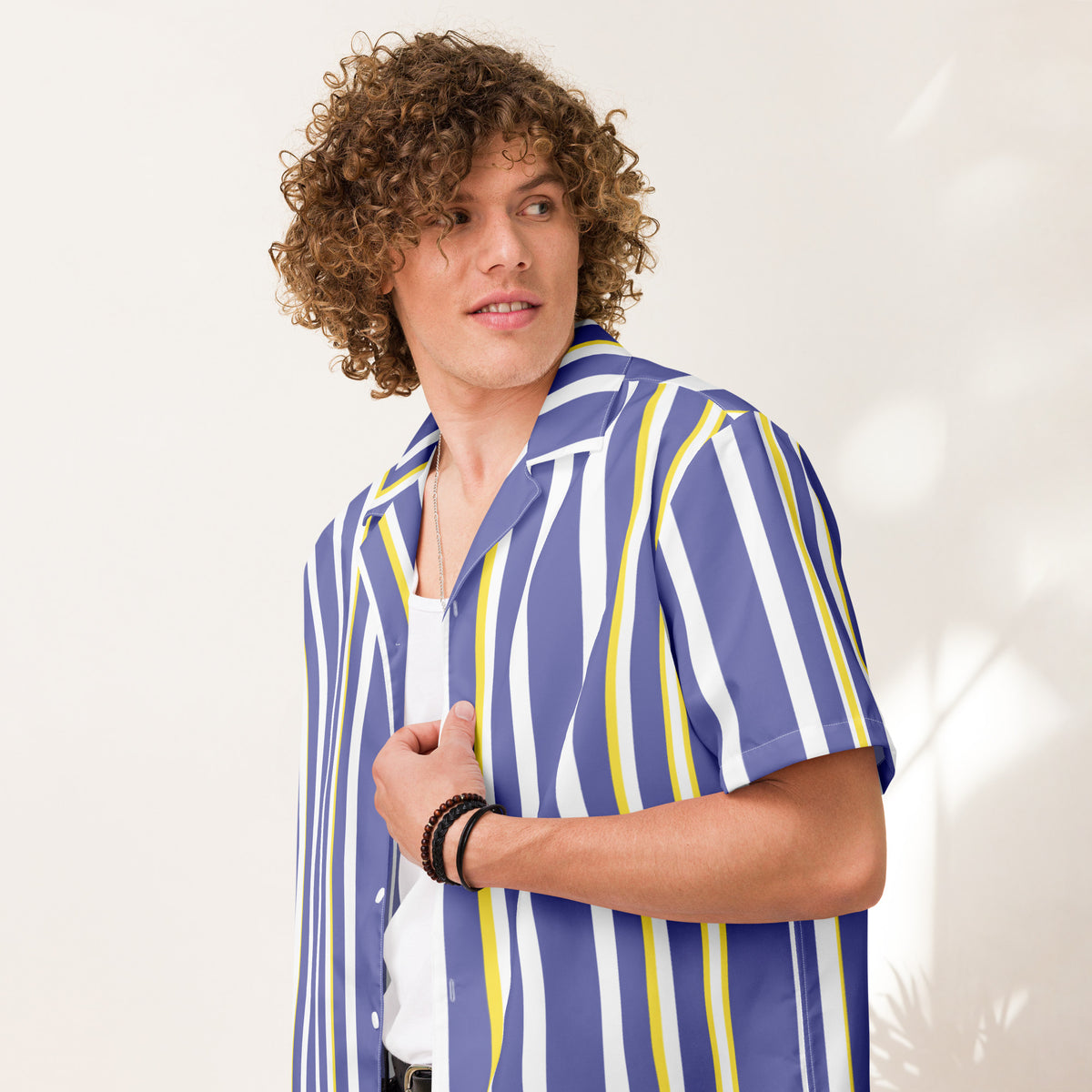 Good Wishes 365 men's periwinkle, white, and yellow vertical striped short sleeve camp collar shirt on a curly-haired model