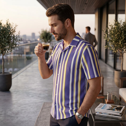 Good Wishes 365 men's periwinkle, white, and yellow vertical striped short sleeve camp collar shirt on a balcony.