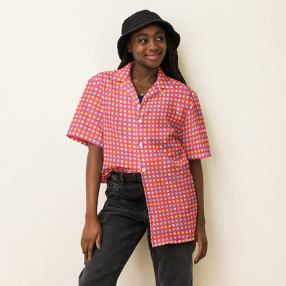 Good Wishes 365 pink checkered UPF 50+ button-down shirt worn by a smiling woman with a black bucket hat.