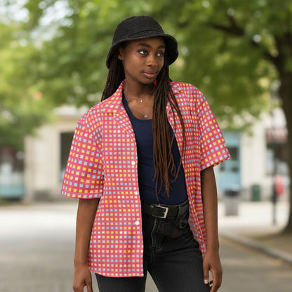 Good Wishes 365 pink checkered UPF 50+ button-down shirt worn by a model in a casual outdoor setting.